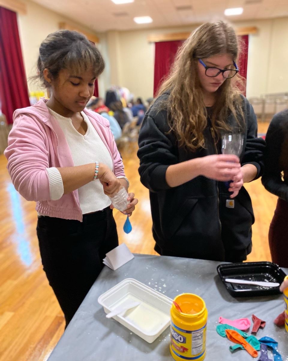 Students participate in a Woodward Wellness program about stress relief and make stress balls.