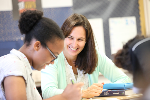 photo of a student and a teacher working together