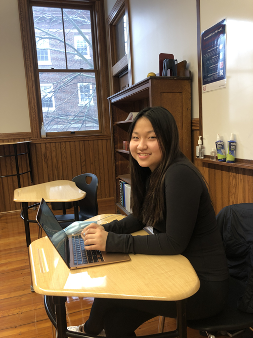 photo of student sitting at desk