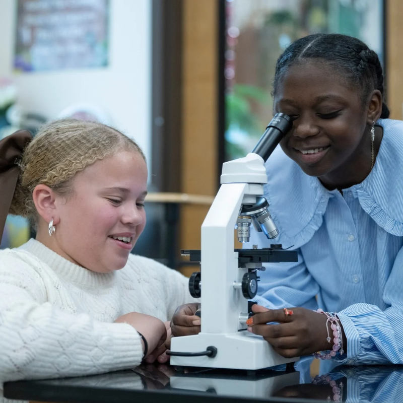 Woodward Students pictured with microscope