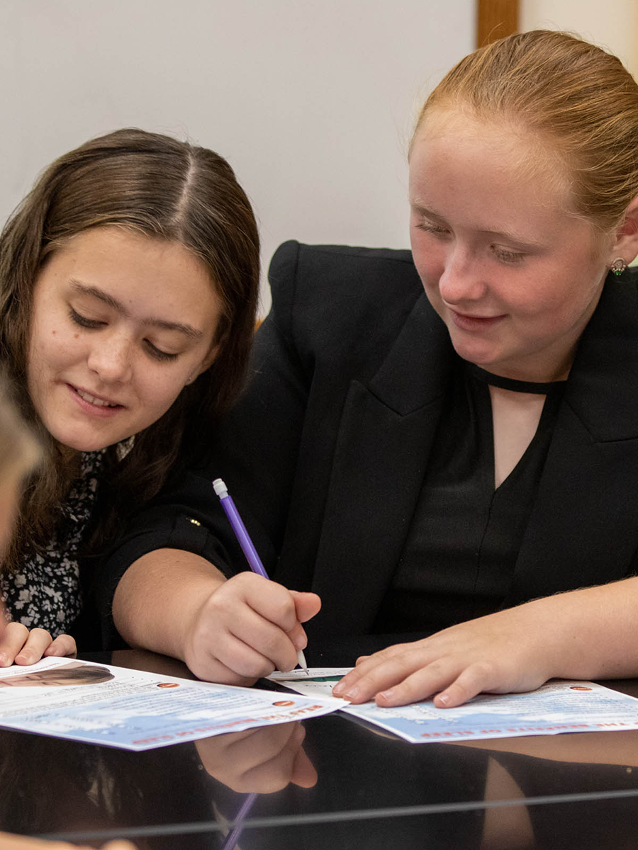 A few students learn about how to effectively work together on an assigned project.