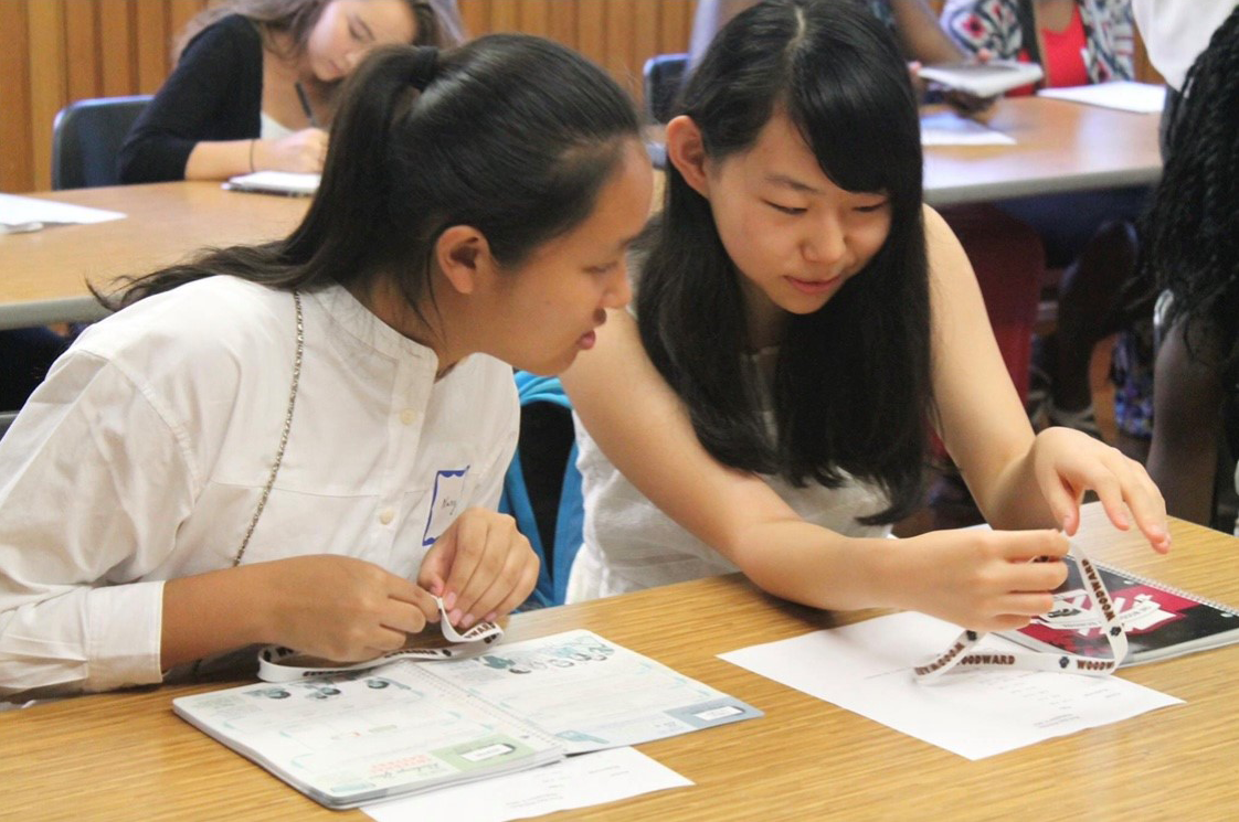 International Students working at tables