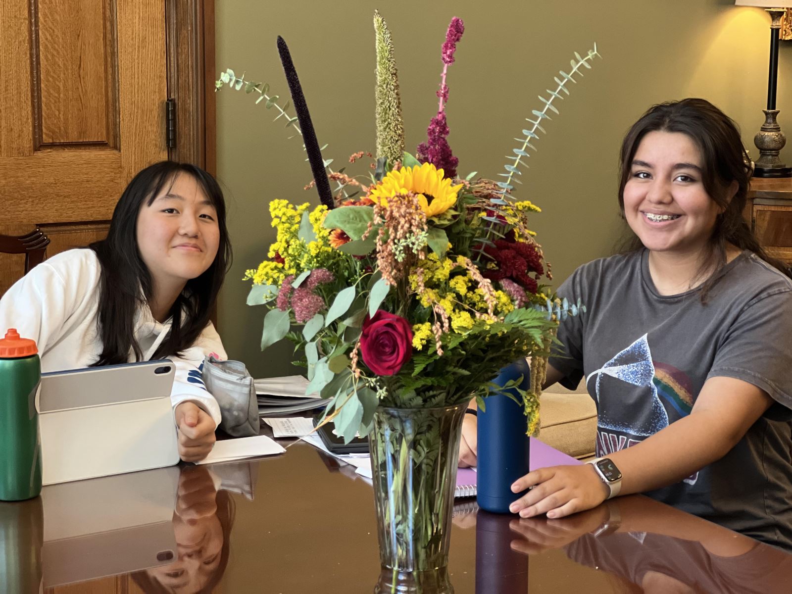 International Students at a table at The Woodward School