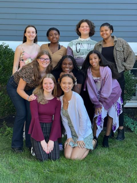 Photo of Woodward students in front of big blue house