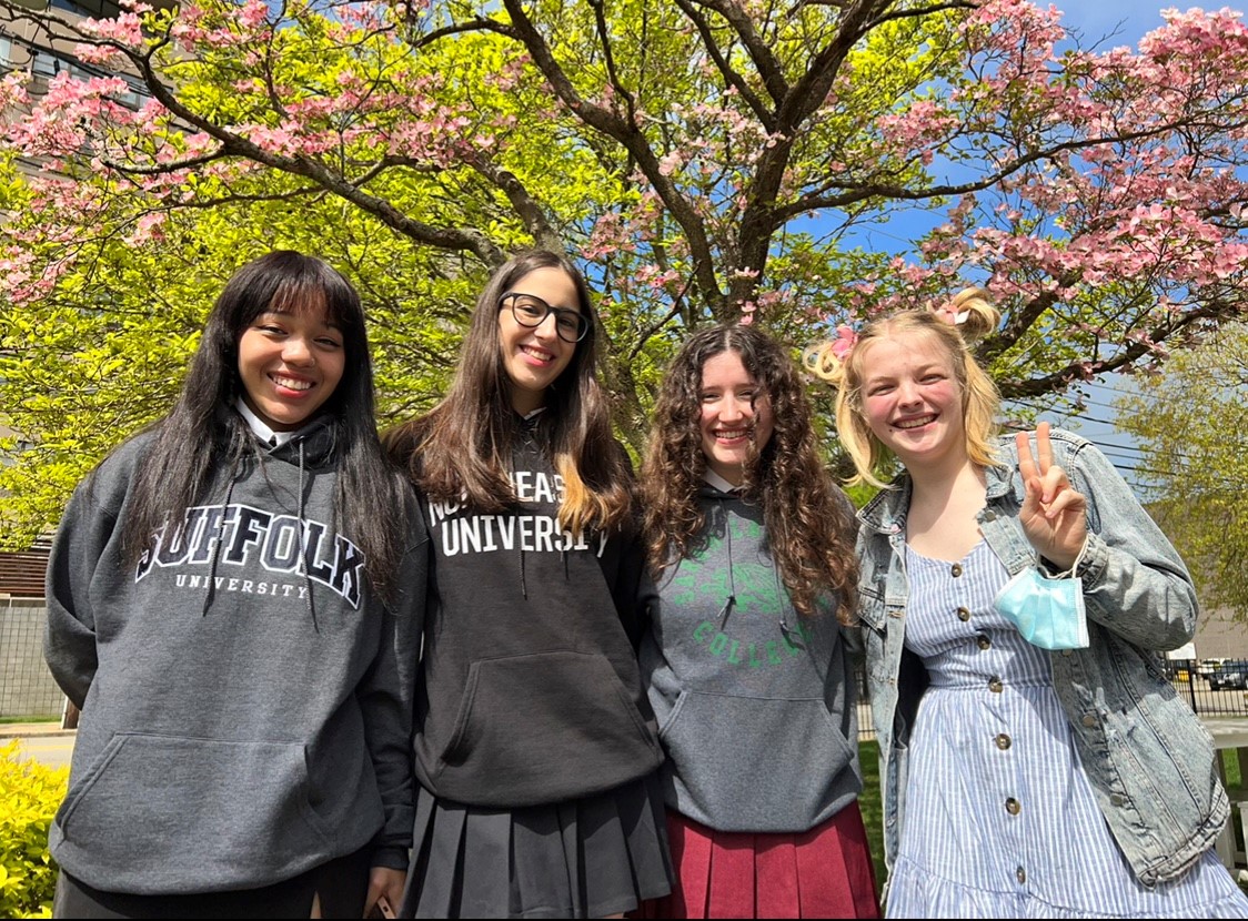 4 Woodward Alumnae pose outside the school