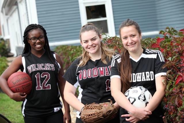 Woodward Athletes outside The Blue House