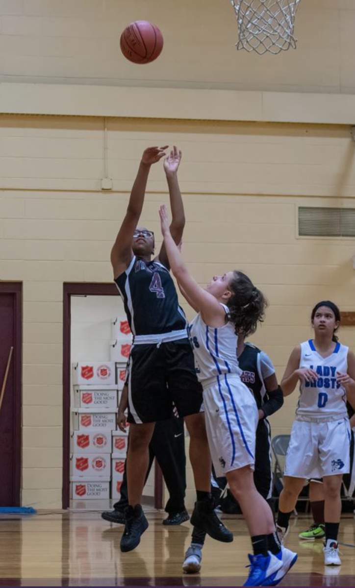 picture of girls actively playing basketball