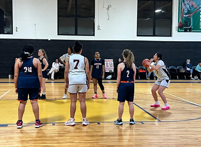 Woodward Basketball player makes free throw with other players lined up