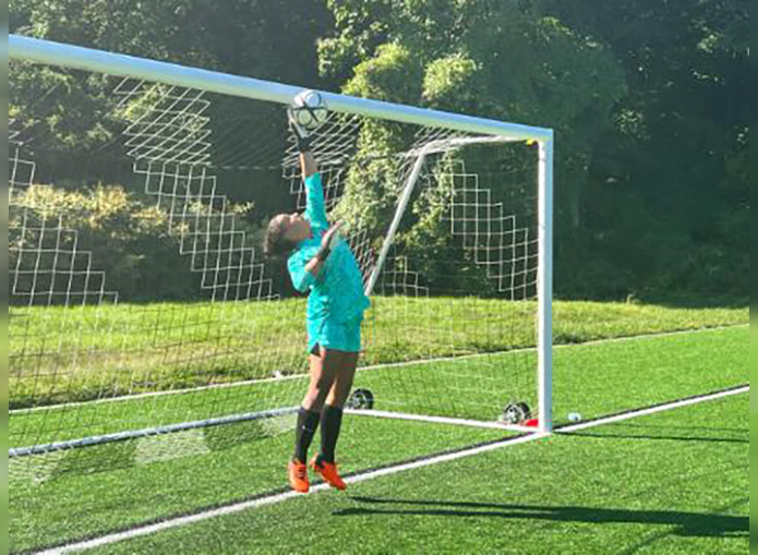 Woodward soccer player jumps to block goal 