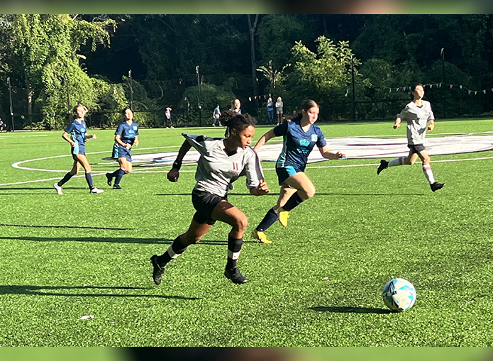 Woodward soccer players running to kickoff
