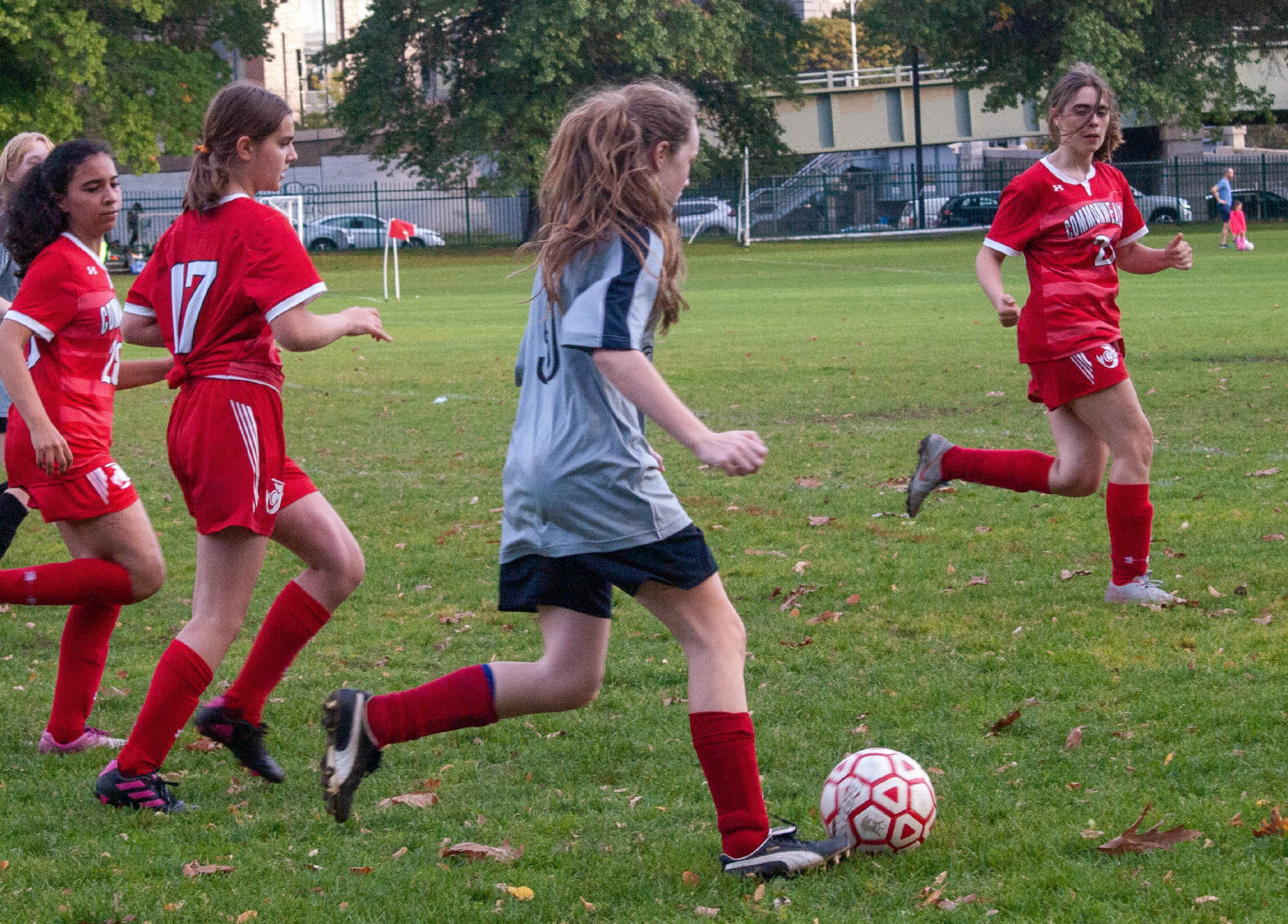 Woodward soccer player dribbling through the opposing team defense