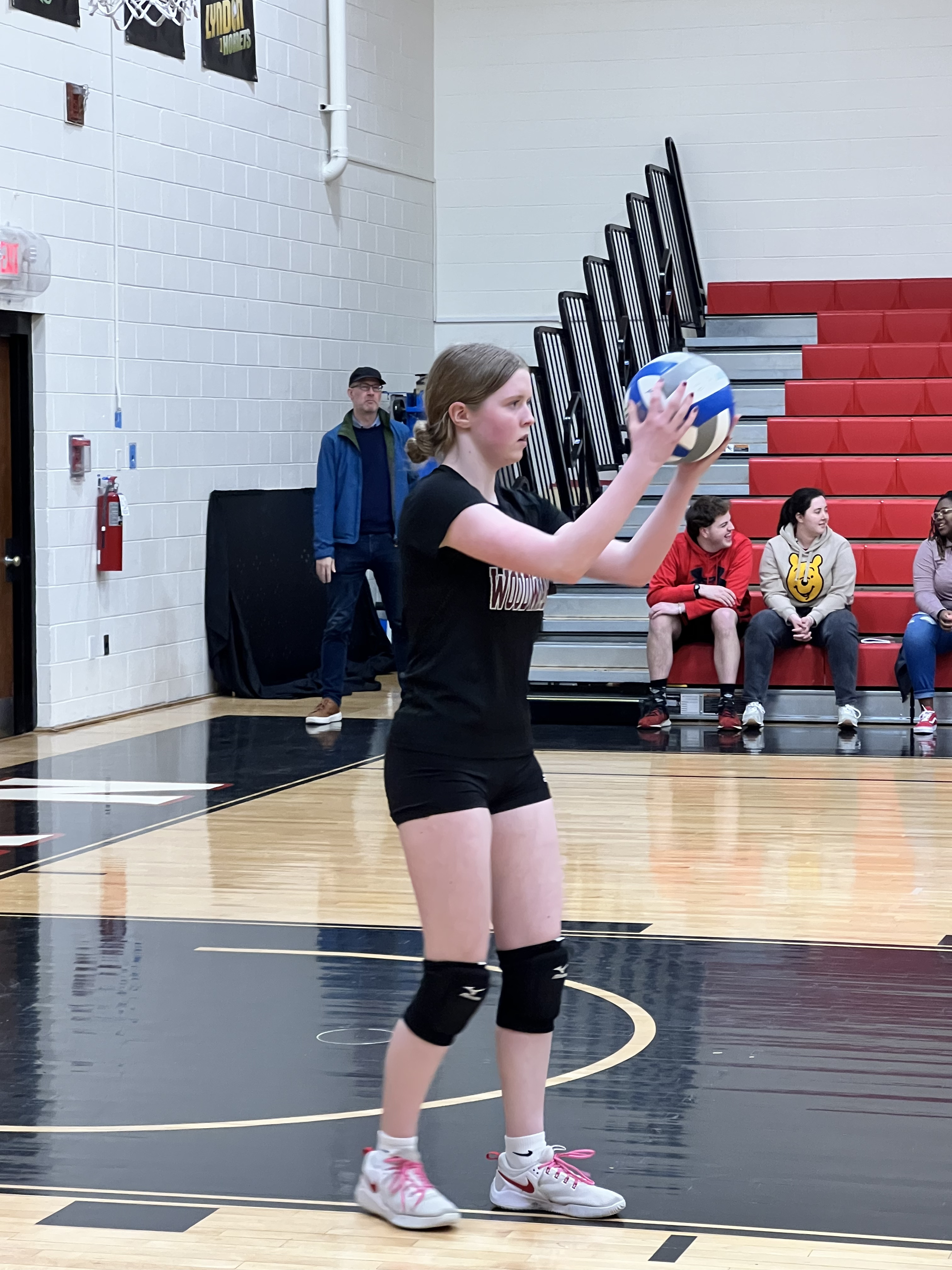 Woodward Volleyball Player prepares to serve