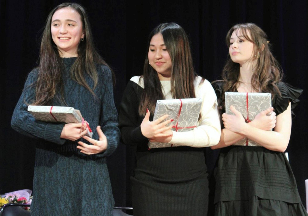 Woodward Students Holding Gifts