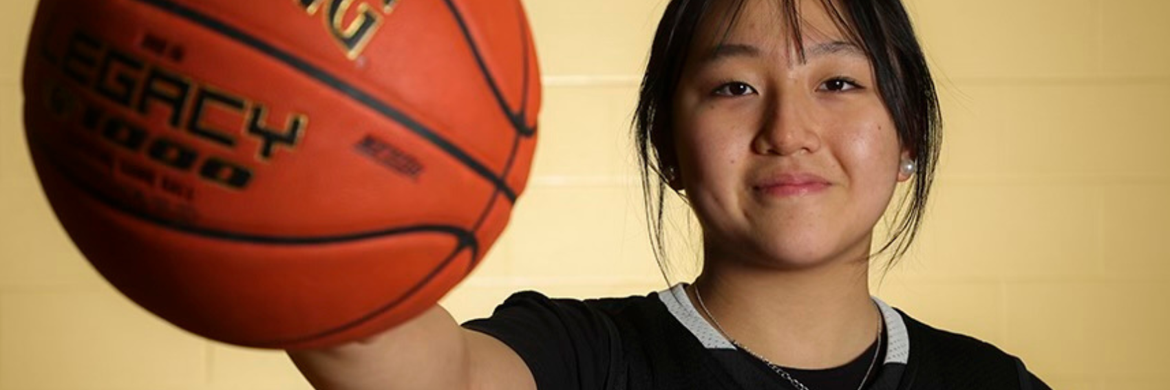 Woodward Student holding a basketball