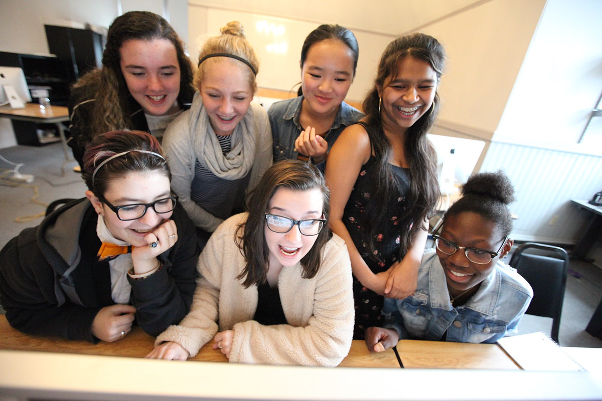 Girls Gathered around a Computer Screen