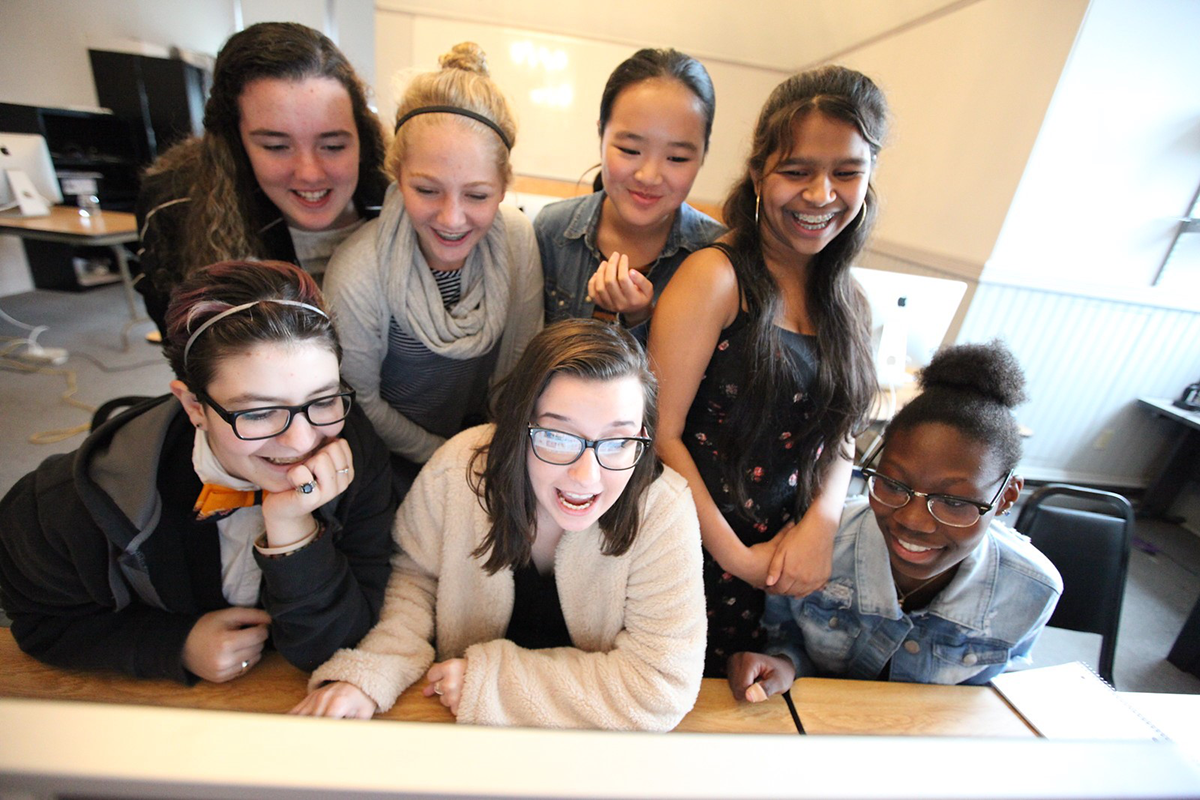 Woodward Students Gathered Around a Computer